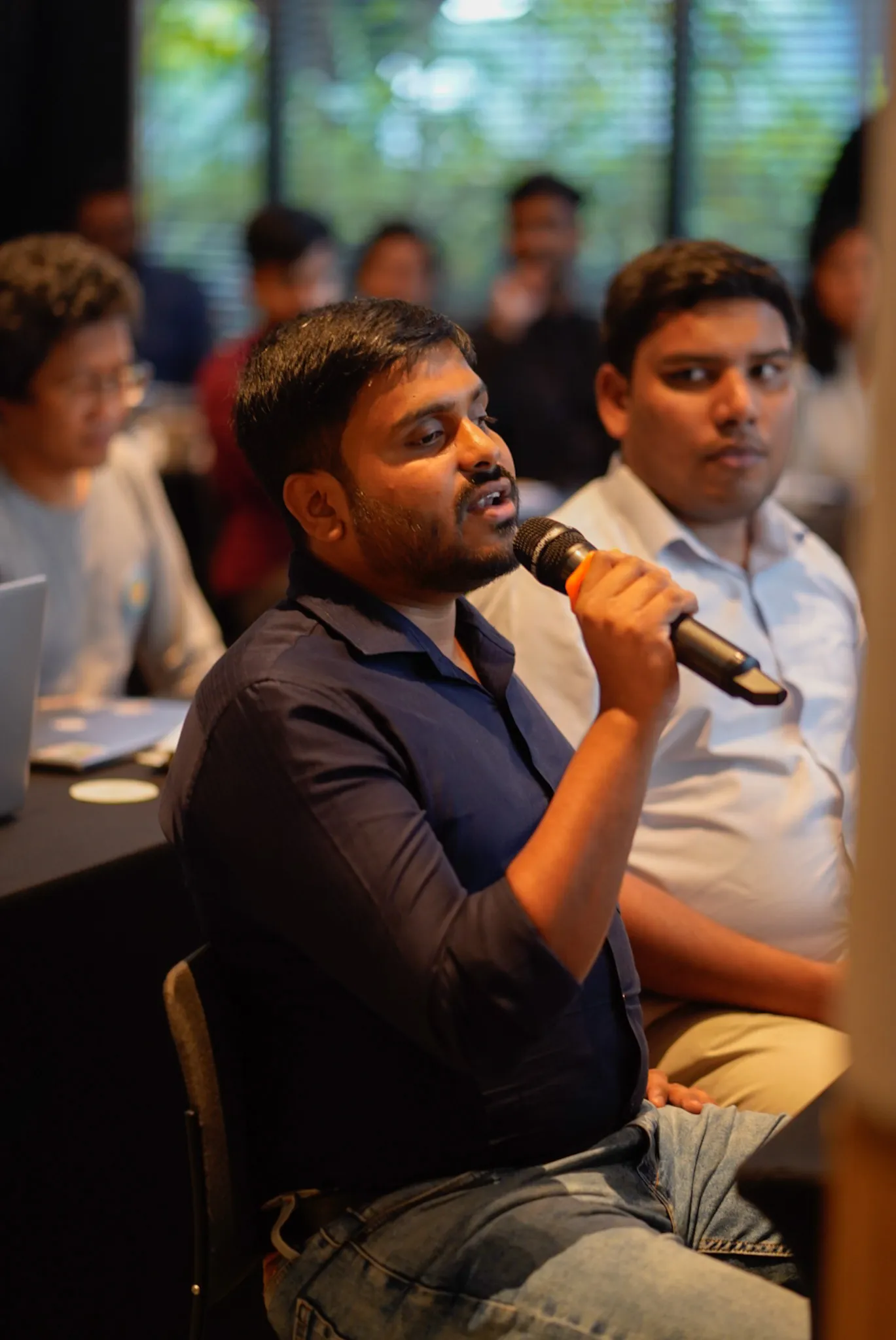 Founders working together around a table during the Cohort 2 bootcamp in Jakarta